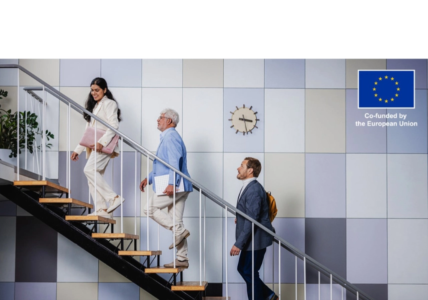 Woman and two men walking up the stairs