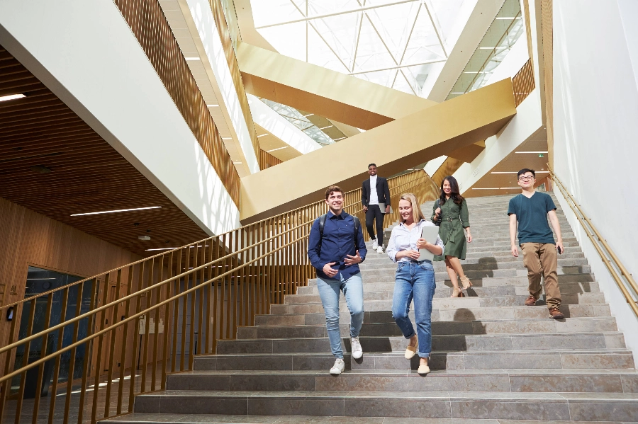 Group of students walking down the stairs