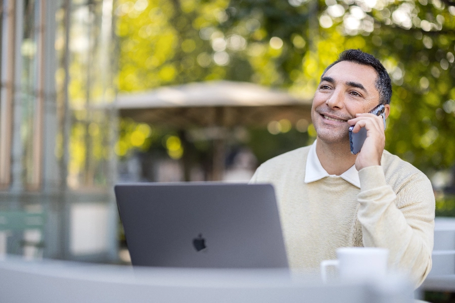 Man working outside in a cafe