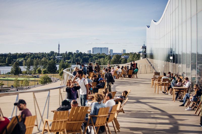 People gather on an outside terrace in Helsinki. - Jussi Hellsten / Helsinki Partners