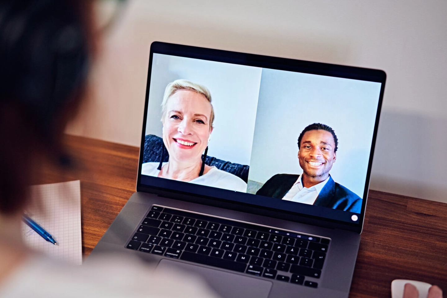 A person is having online meeting with two people A person is having online meeting with two people