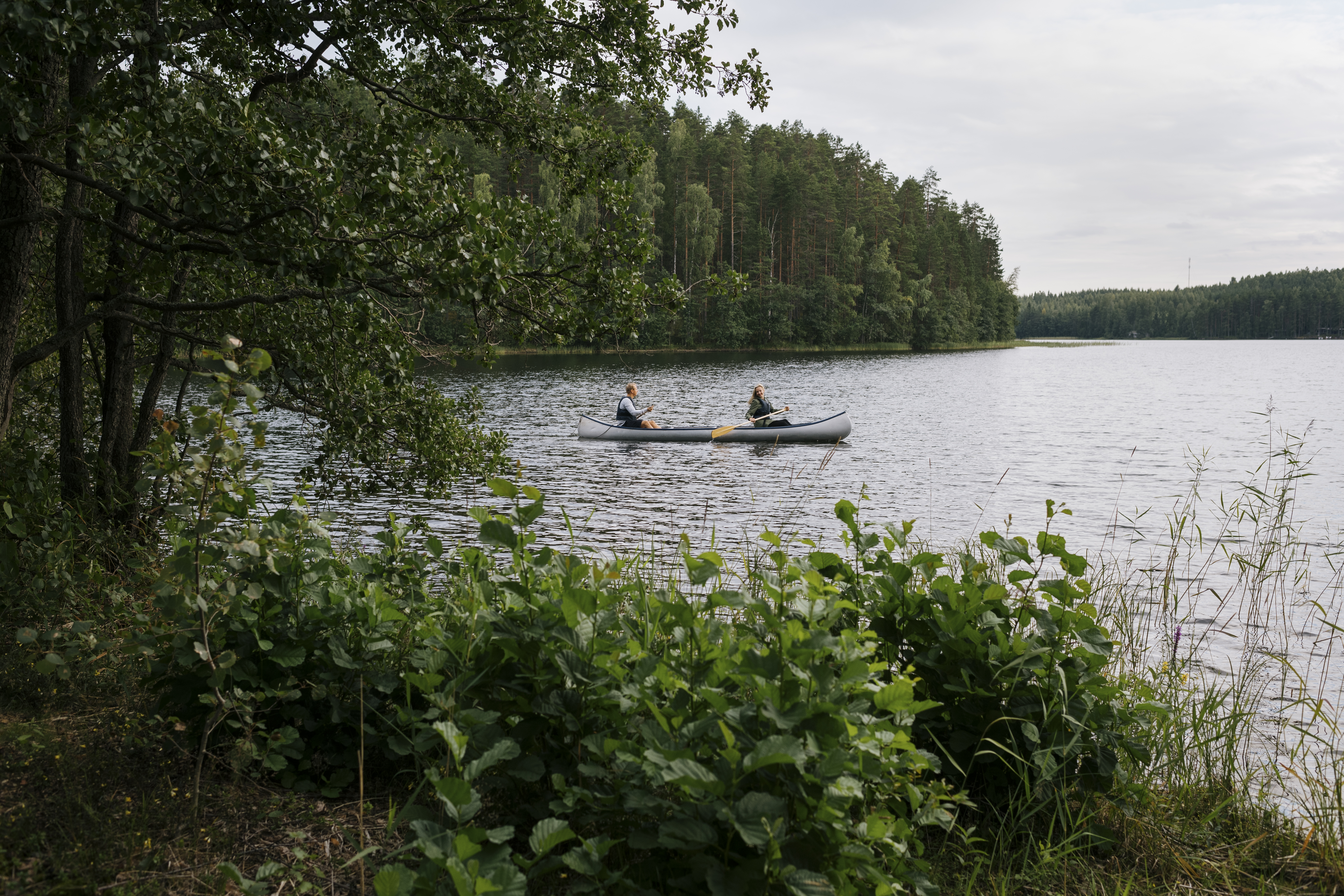 people paddling on a lake in Finland