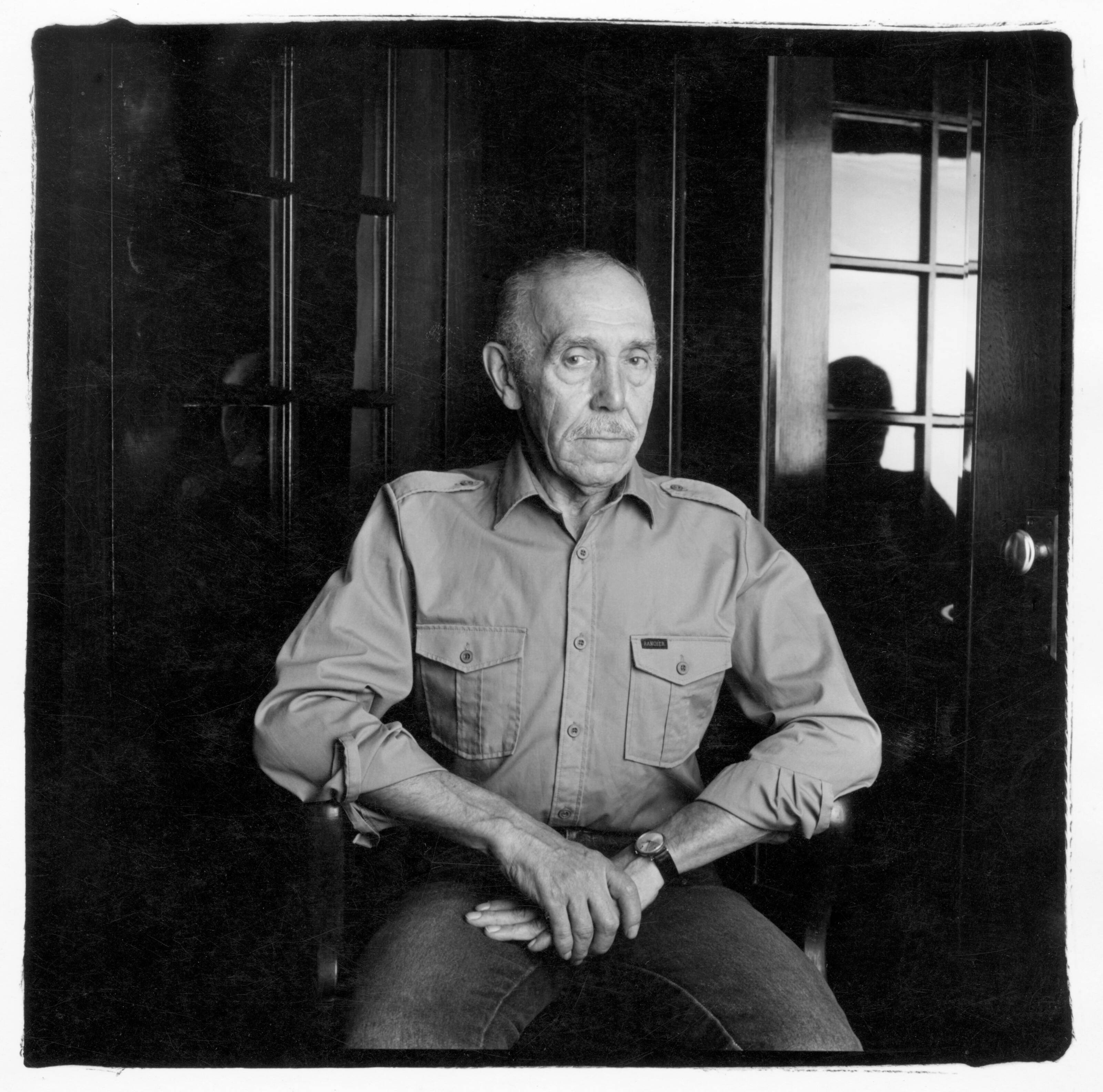 Touko Laaksonen, Tom of Finland, artist sitting in a chair